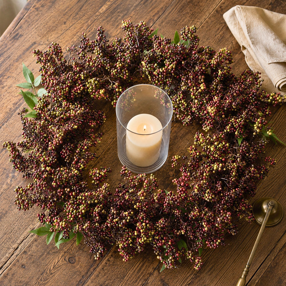 Dark berry wreath around a glass hurricane with a flameless LED candle
